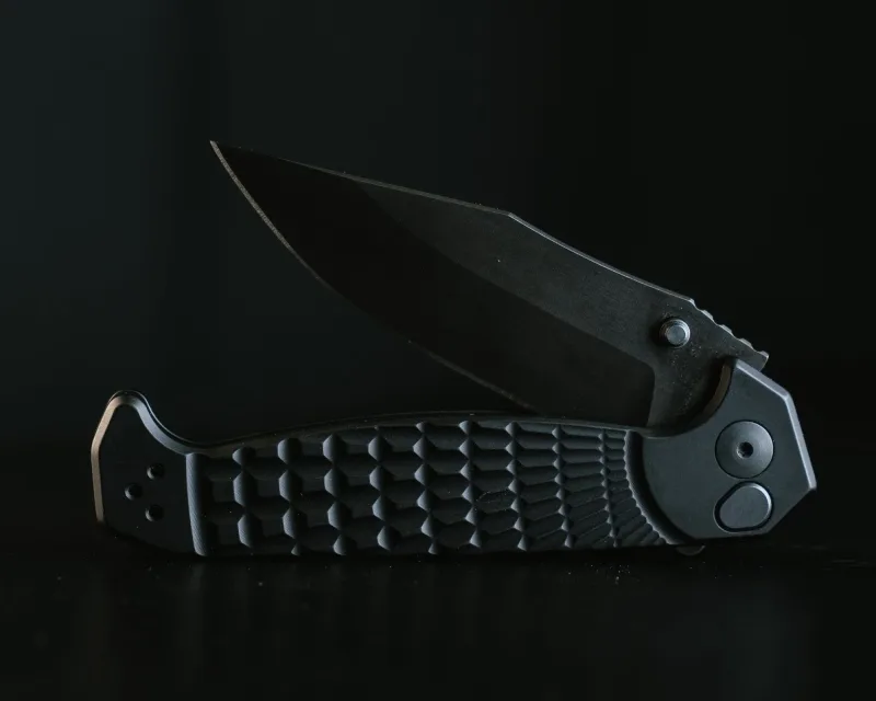Crow Folder- Anodized Black Frame, Nitride Black Blade, Grenade Stippled Grip, Deep Carry Pocket Clip